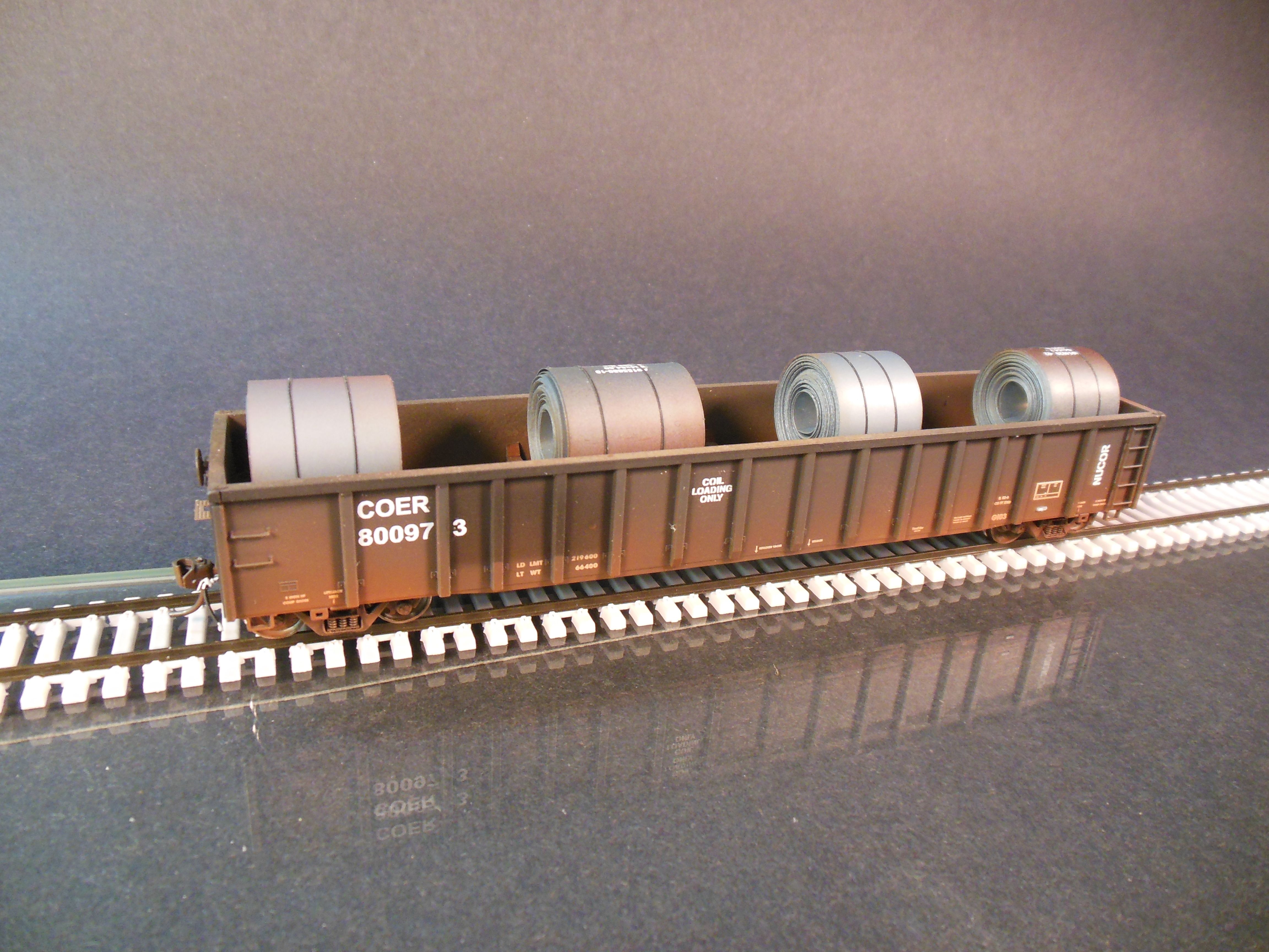 ExactRail HO scale gondola with coiled plate steel. Protoloads