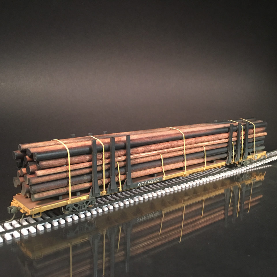 Atlas HO scale 89’ flatcar with utility poles Protoloads