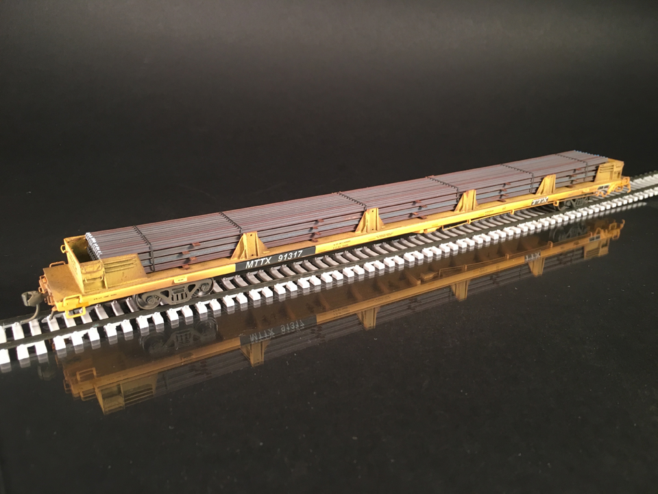 Atlas HO scale 89’ flatcar with new steel rail Protoloads