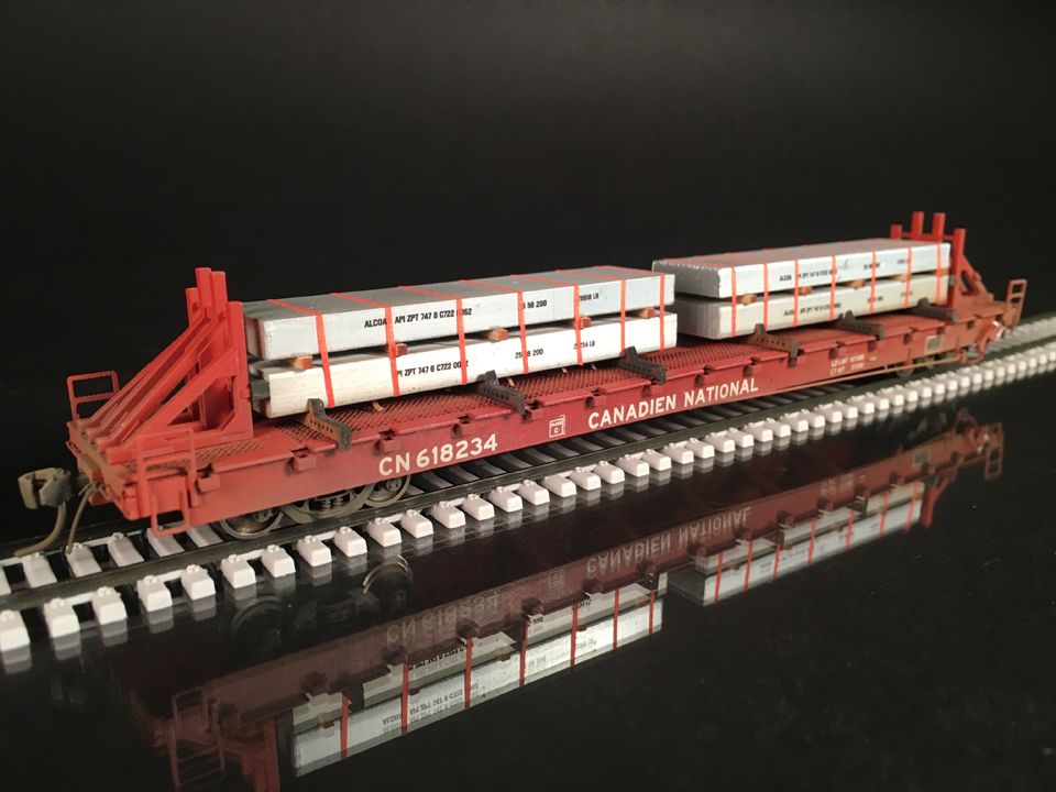 Protoloads HO scale 60’ flat with ingots Protoloads