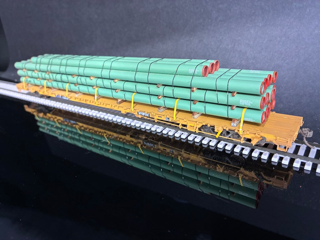 WalthersProto HO Scale 110 Ton Flatcar with Line Pipe