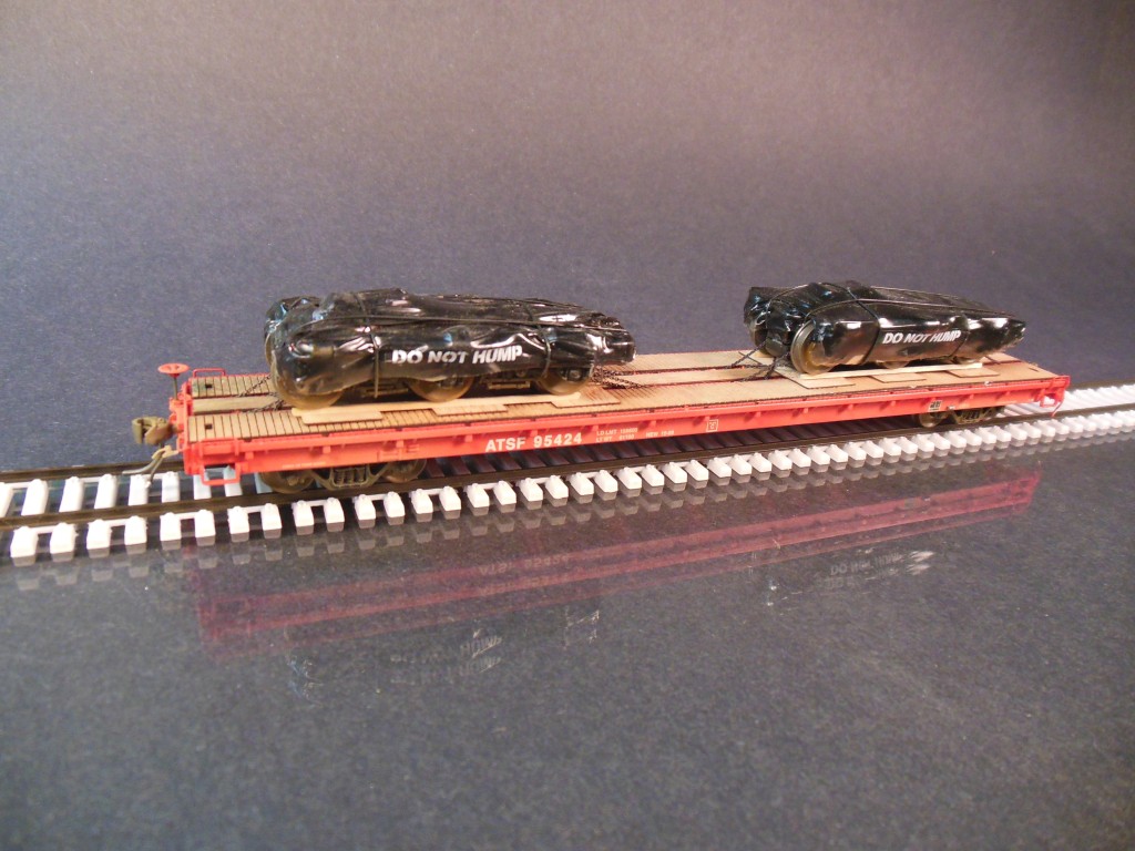 Intermountain HO scale flatcar with trucks. Protoloads